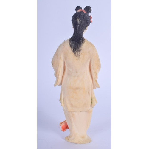 1219 - AN EARLY 20TH CENTURY CHINESE PAINTED IVORY FIGURE OF A FEMALE Late Qing. 15 cm high.