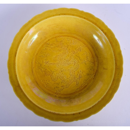 1224 - A CHINESE YELLOW GLAZED PORCELAIN SCALLOPED DISH 20th Century, decorated with dragons. 21 cm wide.