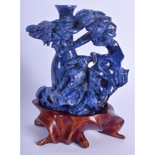 1227 - AN EARLY 20TH CENTURY CHINESE CARVED LAPIS LAZULI FIGURE Late Qing/Republic, of flowering form. Lapi... 