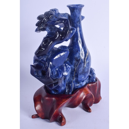 1227 - AN EARLY 20TH CENTURY CHINESE CARVED LAPIS LAZULI FIGURE Late Qing/Republic, of flowering form. Lapi... 