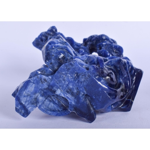 1227 - AN EARLY 20TH CENTURY CHINESE CARVED LAPIS LAZULI FIGURE Late Qing/Republic, of flowering form. Lapi... 