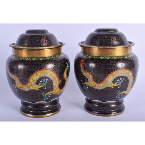 1232 - A PAIR OF EARLY 20TH CENTURY CHINESE CLOISONNÉ ENAMEL JARS AND COVERS Late Qing. 18 cm high.