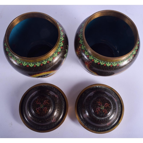 1232 - A PAIR OF EARLY 20TH CENTURY CHINESE CLOISONNÉ ENAMEL JARS AND COVERS Late Qing. 18 cm high.