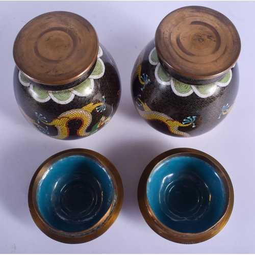 1232 - A PAIR OF EARLY 20TH CENTURY CHINESE CLOISONNÉ ENAMEL JARS AND COVERS Late Qing. 18 cm high.