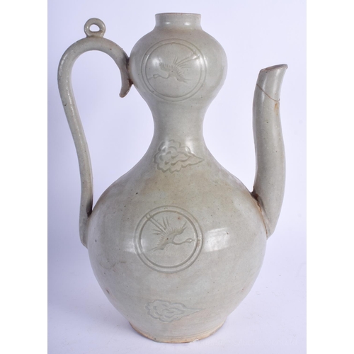 1233 - A KOREAN INCISED CELADON GLAZED EWER probably Colonial Period, Goryeo Dynasty style, decorated with ... 