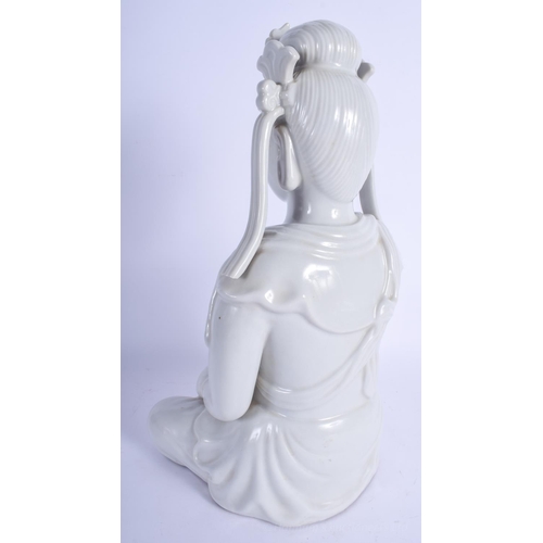 1240 - A LARGE EARLY 20TH CENTURY CHINESE BLANC DE CHINE FIGURE OF AN IMMORTAL modelled clutching her robes... 