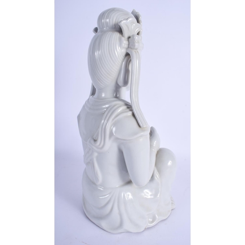 1240 - A LARGE EARLY 20TH CENTURY CHINESE BLANC DE CHINE FIGURE OF AN IMMORTAL modelled clutching her robes... 