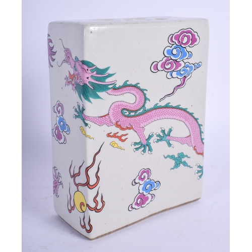 1244 - A CHINESE FAMILLE ROSE PORCELAIN PILLOW 20th Century, decorated with dragons. 14 cm x 9 cm.