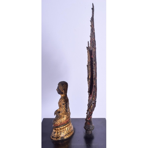 1247 - A VERY UNUSUAL 19TH CENTURY THAI SOUTH EAST ASIAN BRONZE BUDDHA modelled behind a jewelled flame. 33... 