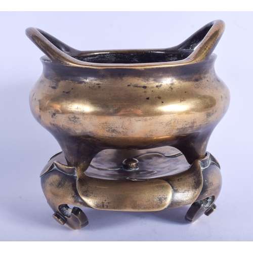 1251 - AN 18TH/19TH CENTURY CHINESE TWIN HANDLED BRONZE CENSER ON STAND Qing, bearing Xuande marks to base.... 