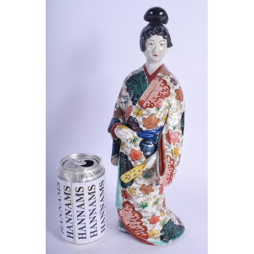 1255 - A 19TH CENTURY JAPANESE MEIJI PERIOD KAKIEMON IMARI FIGURE OF A FEMALE modelled holding a fan. 32 cm... 