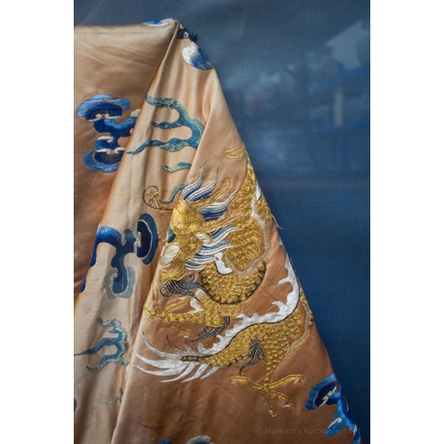 1262 - A VERY LARGE 19TH CENTURY FRAMED IMPERIAL CHINESE ROBE Qing, decorated with dragons amongst crashing... 