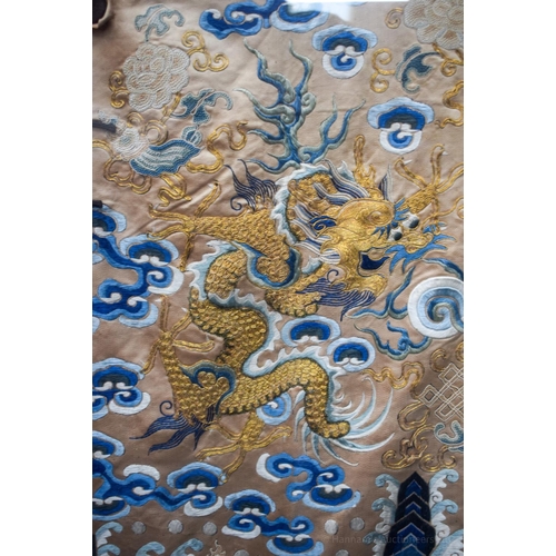 1262 - A VERY LARGE 19TH CENTURY FRAMED IMPERIAL CHINESE ROBE Qing, decorated with dragons amongst crashing... 