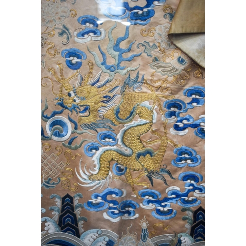 1262 - A VERY LARGE 19TH CENTURY FRAMED IMPERIAL CHINESE ROBE Qing, decorated with dragons amongst crashing... 