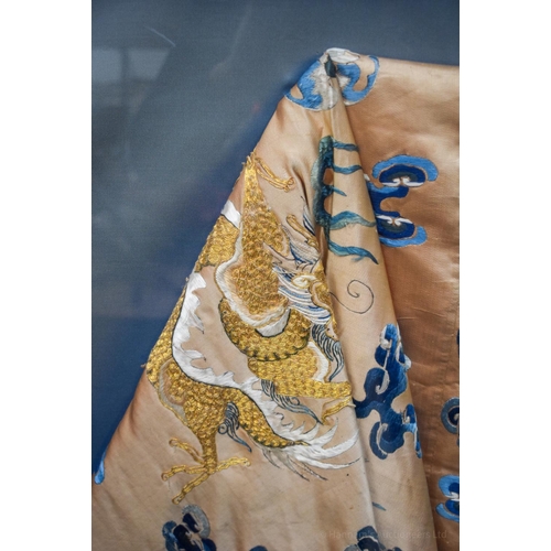 1262 - A VERY LARGE 19TH CENTURY FRAMED IMPERIAL CHINESE ROBE Qing, decorated with dragons amongst crashing... 