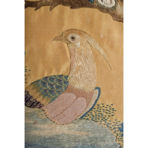 1277 - A 19TH CENTURY CHINESE CANTON SILKWORK EMBROIDERED BIRD PANEL Qing, decorated with birds within land... 