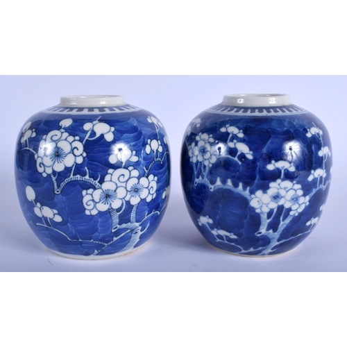 1297 - A PAIR OF 19TH CENTURY CHINESE BLUE AND WHITE GINGER JARS Kangxi style, painted with prunus. 14 cm x... 