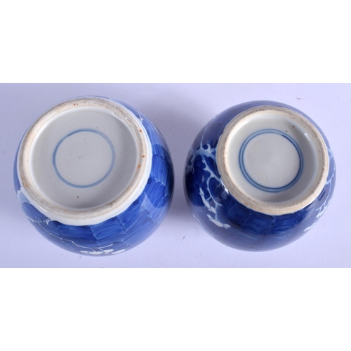 1297 - A PAIR OF 19TH CENTURY CHINESE BLUE AND WHITE GINGER JARS Kangxi style, painted with prunus. 14 cm x... 