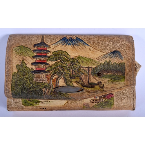 1300 - A 1930S JAPANESE TAISHO PERIOD EMBOSSED LEATHER PURSE decorated with landscapes. 21 cm x 13 cm.