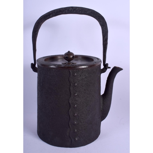 1301 - A 19TH CENTURY CAST IRON AND BRONZE TETSUBIN TEAPOT with peach finial. 25 cm high inc handle.