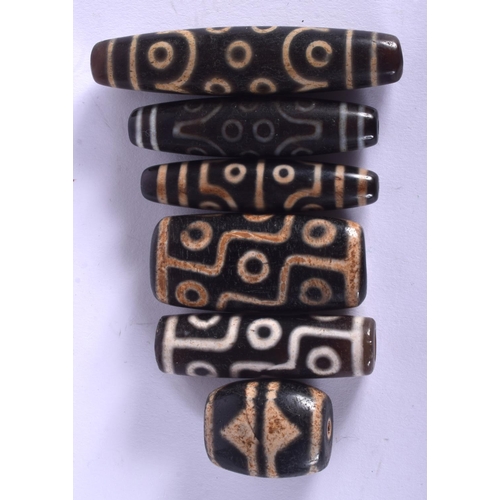 1316 - SIX CHINESE TIBETAN AGATE ZHU BEADS 20th Century. Largest 7 cm long. (6)