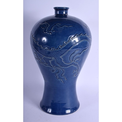 1374 - A LARGE CHINESE QING DYNASTY BLUE GLAZED STONEWARE POTTERY VASE decorated with three claw dragons am... 