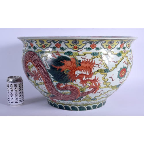 1376 - A LARGE EARLY 20TH CENTURY CHINESE WUCAI PORCELAIN JARDINIERE painted with five claw dragons amongst... 