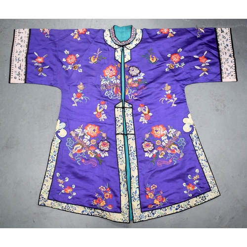 1377 - AN EARLY 20TH CENTURY CHINESE SILKWORK EMBROIDERED ROBE Late Qing, decorated with flowers and foliag... 