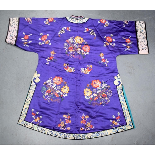 1377 - AN EARLY 20TH CENTURY CHINESE SILKWORK EMBROIDERED ROBE Late Qing, decorated with flowers and foliag... 