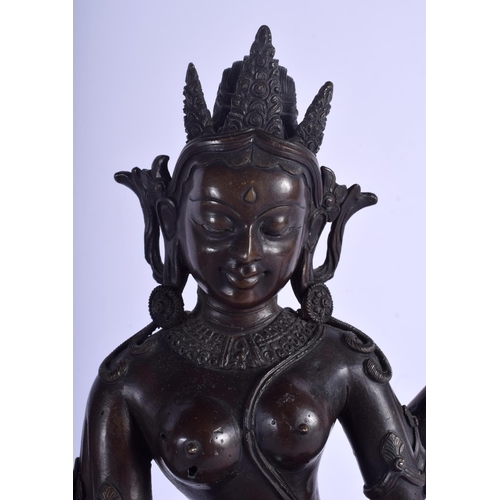 1393 - A GOOD 19TH CENTURY CHINESE NEPALESE INDIAN BRONZE FIGURE OF A DEITY modelled holding stupa and othe... 