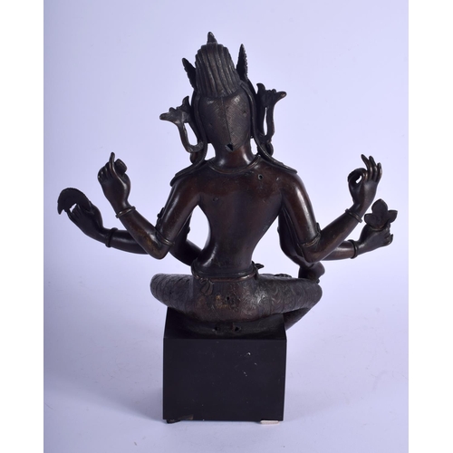 1393 - A GOOD 19TH CENTURY CHINESE NEPALESE INDIAN BRONZE FIGURE OF A DEITY modelled holding stupa and othe... 