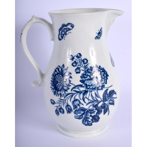 140 - 18th c. Worcester mask jug decorated in blue with flowers and moths. 19 cm high