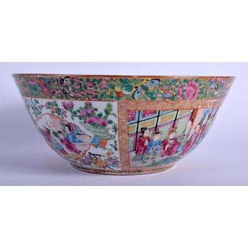 1403 - A LARGE 19TH CENTURY CHINESE CANTON FAMILLE ROSE PUNCH BOWL Qing, painted with figures within interi... 