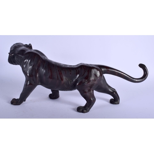 1404 - A 19TH CENTURY JAPANESE MEIJI PERIOD BRONZE OKIMONO OF A TIGER modelled roaming with glass eyes. 50 ... 