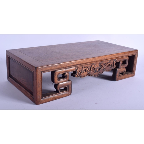 1409 - A 1950S CHINESE CARVED HARDWOOD  LOW OPIUM SCHOLARS TABLE Late Qing/Republic. 40 cm x 20 cm.