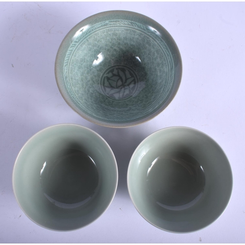 1414 - THREE CHINESE CELADON BOWLS 20th Century. Largest 14 cm wide. (3)