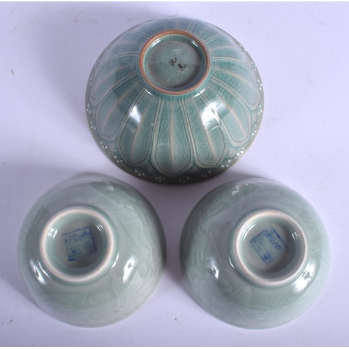 1414 - THREE CHINESE CELADON BOWLS 20th Century. Largest 14 cm wide. (3)