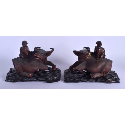 1421 - A PAIR OF 19TH CENTURY CHINESE CARVED BUFFALO HARDWOOD FIGURES Qing. 23 cm x 22 cm.