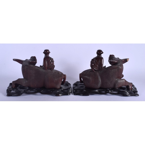 1421 - A PAIR OF 19TH CENTURY CHINESE CARVED BUFFALO HARDWOOD FIGURES Qing. 23 cm x 22 cm.