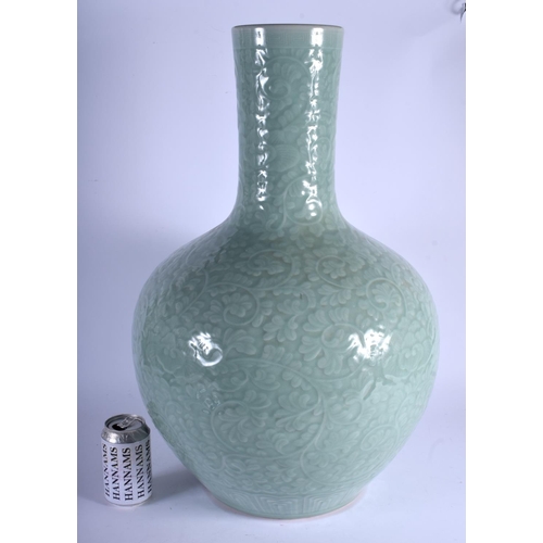 1432 - A LARGE 19TH CENTURY CHINESE CARVED TIAN QIU PING CELADON PORCELAIN VASE Qing, decorated with foliag... 