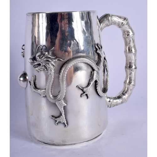 1441 - A VERY RARE 19TH CENTURY CHINESE EXPORT SILVER MUG decorated in relief with dragons pursuing a flami... 