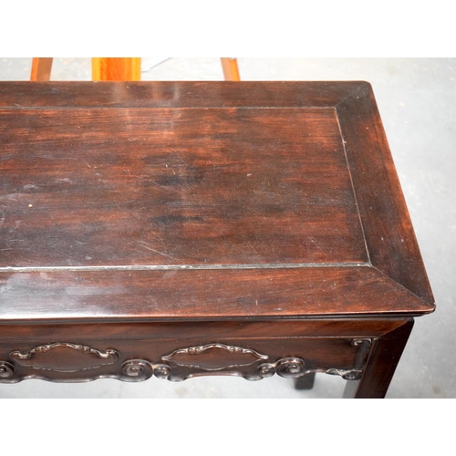 1448 - A 19TH CENTURY CHINESE HONGMU SCROLLING ALTAR TABLE Qing, decorated with a cloud style frieze. 90 cm... 