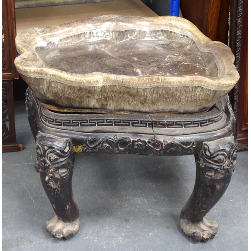 1452 - A LARGE EARLY 20TH CENTURY CHINESE FLUORITE TABLE upon a lacquered hardwood base. 70 cm x 60 cm.