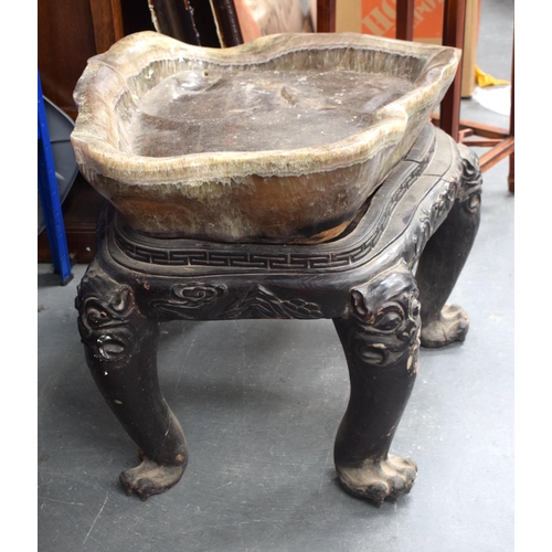 1452 - A LARGE EARLY 20TH CENTURY CHINESE FLUORITE TABLE upon a lacquered hardwood base. 70 cm x 60 cm.