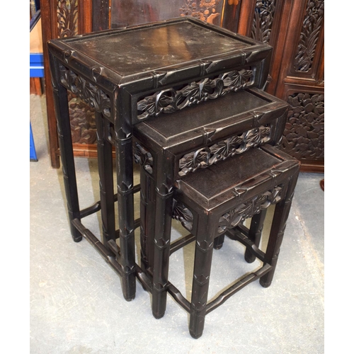 1458 - A NEST OF THREE EARLY 20TH CENTURY CHINESE HARDWOOD TABLES. Largest 60 cm x 45 cm. (3)