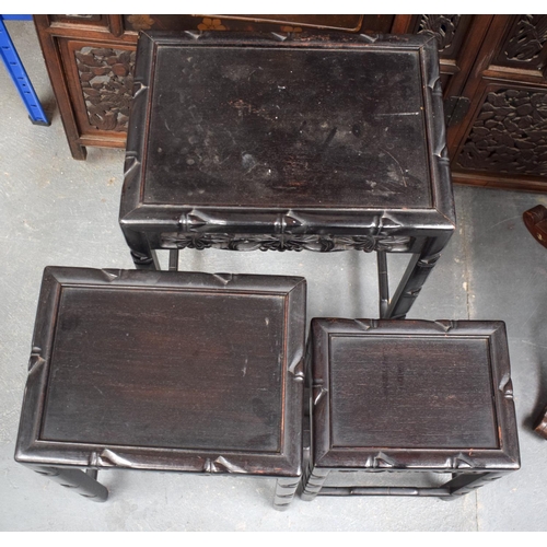 1458 - A NEST OF THREE EARLY 20TH CENTURY CHINESE HARDWOOD TABLES. Largest 60 cm x 45 cm. (3)