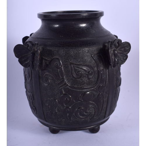 1465 - AN UNUSUAL 19TH CENTURY CHINESE BRONZE VASE Qing, decorated with mask heads and moths. 13 cm x 9 cm.