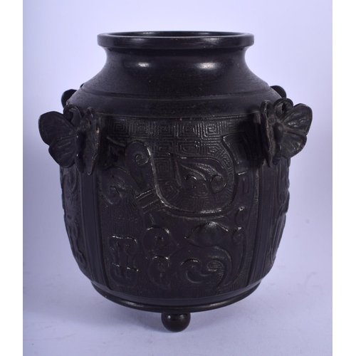 1465 - AN UNUSUAL 19TH CENTURY CHINESE BRONZE VASE Qing, decorated with mask heads and moths. 13 cm x 9 cm.