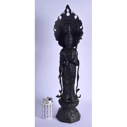 1470 - A VERY LARGE CHINESE IRON FIGURE OF A STANDING BUDDHISTIC DEITY modelled upon a lotus throne. 58 cm ... 