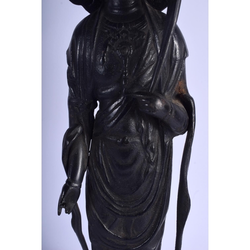 1470 - A VERY LARGE CHINESE IRON FIGURE OF A STANDING BUDDHISTIC DEITY modelled upon a lotus throne. 58 cm ... 